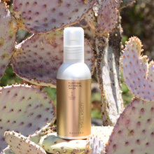 Load image into Gallery viewer, Purifying Botanical Wash 120ml photographed on a Prickly Pear Cactus. Product is by Mikel Kristi Skincare, based in the Arizona desert. This product is Step 1: Cleanse, and comes in a 120ml aluminum pump bottle with metallic gold colored label.
